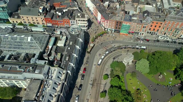 Reversing aerial video of the Luas Tram System operating in Dublin City Centre, County Leinster, Ireland, on a bright and sunny day. Filmed in 4K, 60FPS and with Rec709 color.