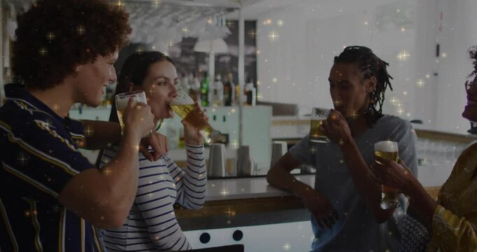 Friends clinking beer glasses for toast on wooden bar counter, sipping beer showing hospitality