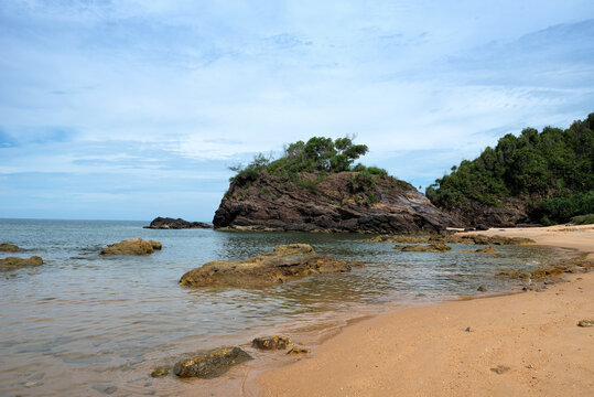 Tranquil Coastal View of Pantai Kuala Kemasik with Rocky Shoreline, Terengganu, Malaysia.