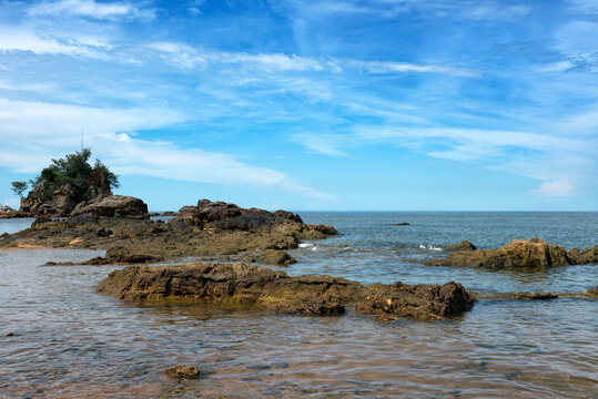 Tranquil Coastal View of Pantai Kuala Kemasik with Rocky Shoreline, Terengganu, Malaysia - This serene coastal scene captures the natural beauty of Pantai Kuala Kemasik in Terengganu, Malaysia.