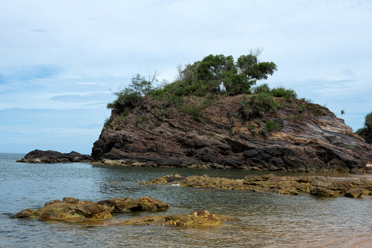 Tranquil Coastal View of Pantai Kuala Kemasik with Rocky Shoreline, Terengganu, Malaysia - This serene coastal scene captures the natural beauty of Pantai Kuala Kemasik in Terengganu, Malaysia.
