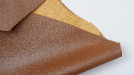close up photo of genuine dark brown cowhide with orange peel pattern