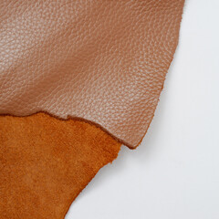 close up photo of genuine dark brown cowhide with orange peel pattern