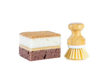 White and brown sponges and brush for washing dishes. Isolated on white.