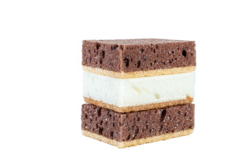 White and brown sponges for washing dishes in the kitchen. Isolated on white.