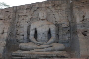 Buddha statue at ruins of the ancient Buddhist rock temple and monastery complex of Gal Vihara (or Uttararama ) in Polonnaruwa city in Sri Lanka