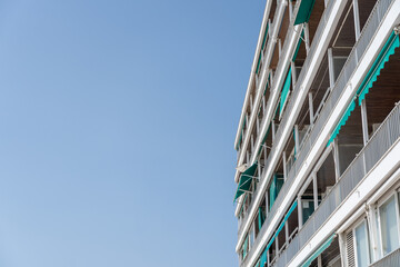 Flat building with blue sky and copy space