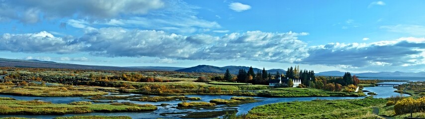 Fototapeta premium Iceland-panoramic view of Thingvellir church and houses next to church