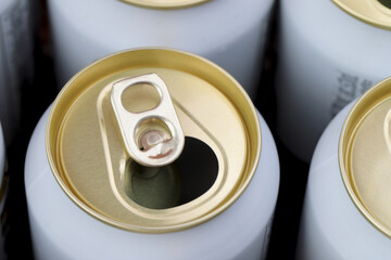 Cold canned beer ready to drink in the fridge