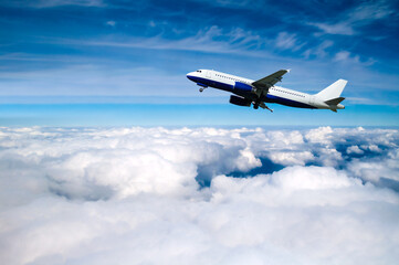 Airplane in the flight, white commercial airplane flying high over the floating clouds, flying airplane background