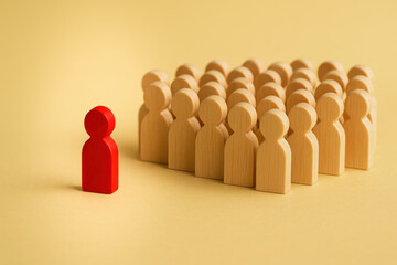 Leadership and influence emerge as one figure stands apart symbolizing distinction and guidance within a collective group dynamic