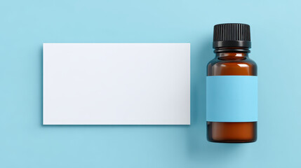 A bottle of essential oil next to a blank card on a soft background perfect for wellness and aromatherapy promotions