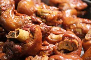 delicious sautéed pig trotters meat close up