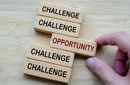 Challenges and Opportunities Coexist, a reminder that every challenge carries potential opportunities, shown through opposing wooden block messages