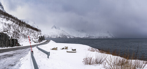 impressive, changing weather moods on the fjord between steep, snow-covered mountains on the island...