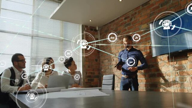 Presenter tapping tablet launching graphics linking blueprints team for business collaboration