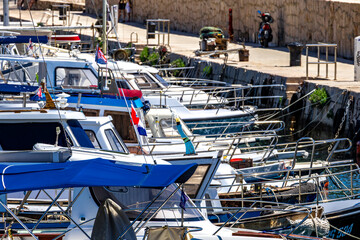 Windsurfing and paragliding in the bay by the beach in Baska on the island of KRK,