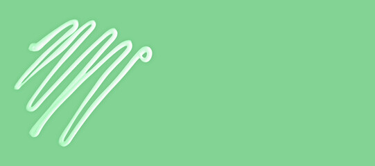 Cream lines on mint green background with empty space for text, cream represents freshness, skincare and wellness. Cream texture conveys softness, cream enhances natural product and spa design themes