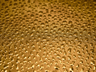 Abstract golden flake metal background with bubbles. Textured metal. Space for your design.