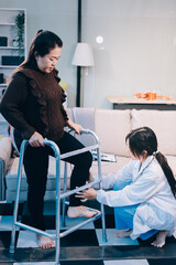 Young doctor examines senior patient's leg.