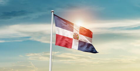 Dominican Republic national flag waving in beautiful sky with mast. A proud moment flag waving with sunlight.