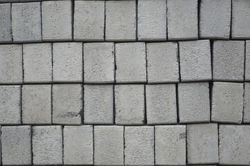 Grey Paving Stone Surface Texture
Close-up of square grey paving stones with a rough, natural...
