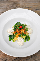 marinated chili prawns on creamy polenta (gluten-free) with ricotta and parsley pesto