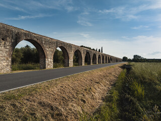 ancient roman aqueduct with arched architecture