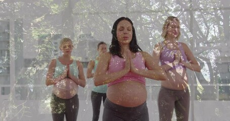 Pregnant women following instructor guiding breathing on mats in prenatal yoga in sunlit studio - Powered by Adobe