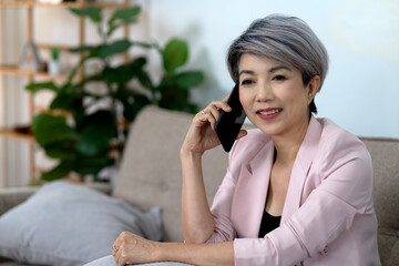 female executive is comfortable and happy using the phone