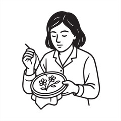 woman embroidering fabric