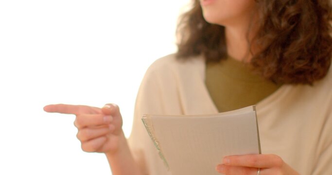 In a lively discussion, one person shares innovative ideas with one hand while holding an important document in the other, improving communication and ensuring their message is clear