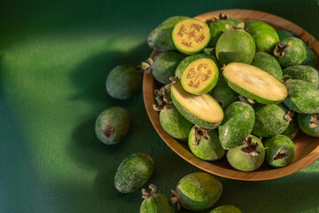 Feijoa green fruit bowl. Diet food. Guava fresh harvest.