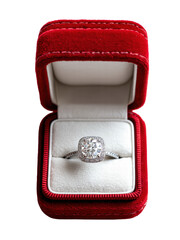 Diamond ring sparkling in open red velvet ring box on transparent background