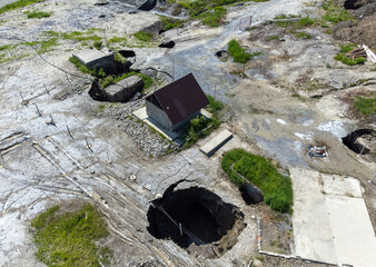 Aerial view of the pits and craters formed by the collapse of the Praid salt mine - Romania