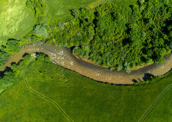 Aerial view of the Corund stream polluted with salt water from the Praid salt mine - Romania