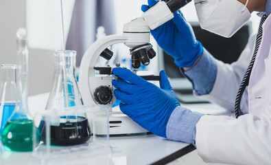 Scientist working microscope doing research in laboratory. Scientist in a lab, adjusting a microscope, evoking precision and scientific inquiry.