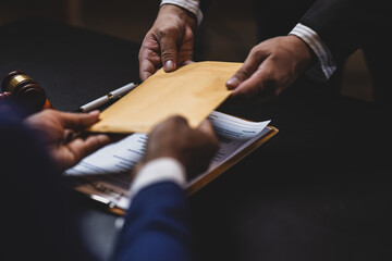 Lawyer receiving envelope with money for bribery. Corrupt lawyer receiving a bribe in an office, showcasing unethical behavior in law and finance. Hands accept money envelope.