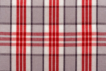 Checkered red fabric. Textile. Checkered fabric background with red and white cells