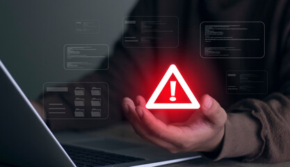 Warning alert icon with a hacked system. malicious software, virus, spyware, malware, or cyberattacks on computer networks. Security on the internet and online scam. Digital data is being compromised.
