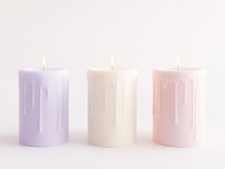 Three Pastel Candles Lit in Minimalist Setting
