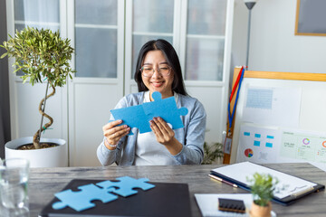 Young Thai Woman Working from Home and Completing a Puzzle..