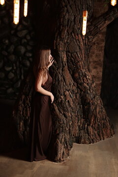 Fototapeta An Ethereal Figure Draped in Earthy Textures Situated within a Captivating Mystical Setting