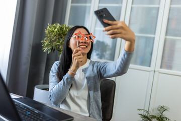 Young Thai Woman Taking a Selfie with Star-Shaped Glasses
