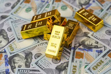 gold bars, dollars. Gold bar on US dollar banknotes, concept of economic investment, exchange