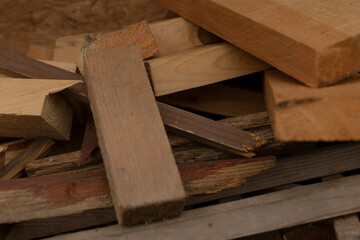 This collection consists of various assorted wood pieces, including both planks and smaller scraps, which are suitable for a wide range of construction or specialized woodworking projects