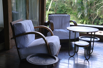 Two Cozy Wooden Armchairs with Coffee Table on Tropical Villa Terrace
