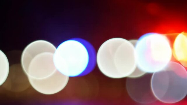 Dynamic police lights at night abstract blur with bokeh effect transition.