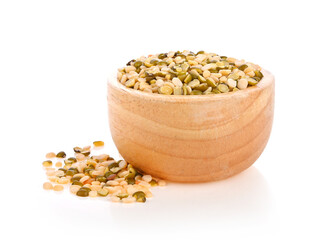 Dry lentils seeds or vegan protein source in wooden bowl isolated on white background