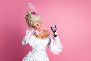 Graceful noblewoman in baroque attire holding a glass goblet against a vibrant pink backdrop showcasing historical and modern blend.
